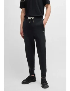 Embossed-Artwork Stretch Cotton Tracksuit Bottoms