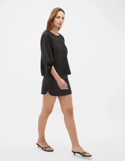 LINEN CURVE HEM MINI SKIRT